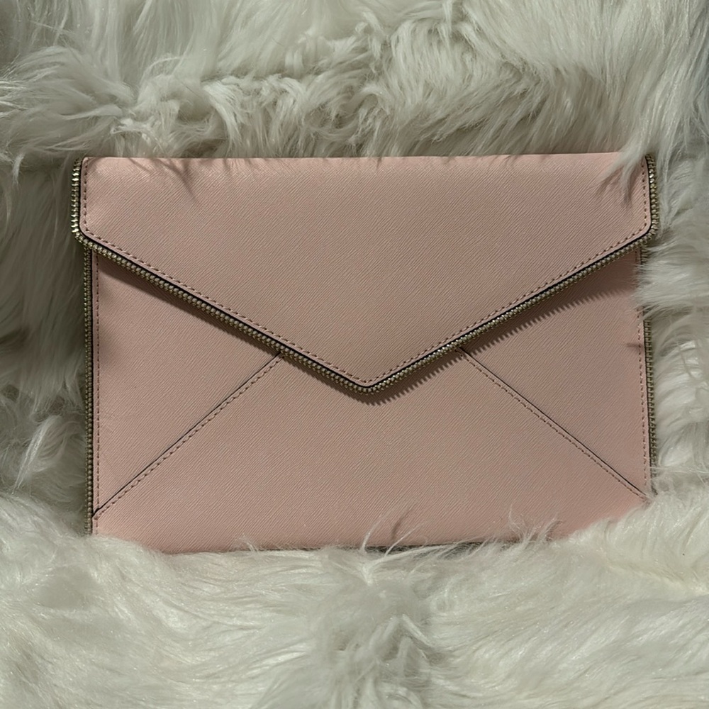 The color is peony. Beautiful never used clutch.